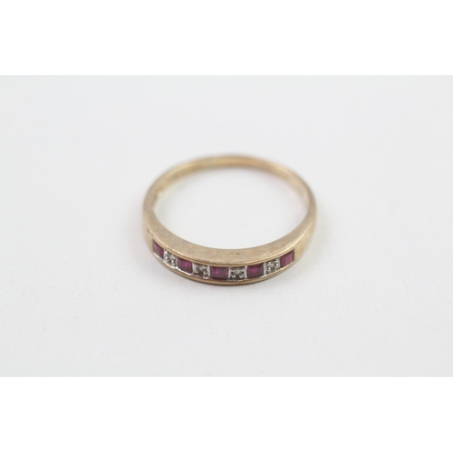 21 - 9ct gold ruby and diamond set nine stone eternity ring (1.9g) Size  Q