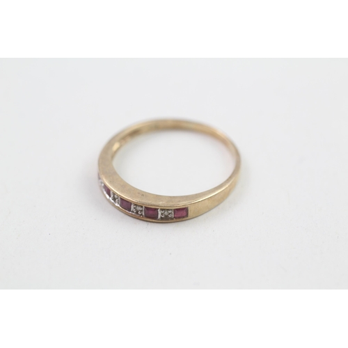 21 - 9ct gold ruby and diamond set nine stone eternity ring (1.9g) Size  Q