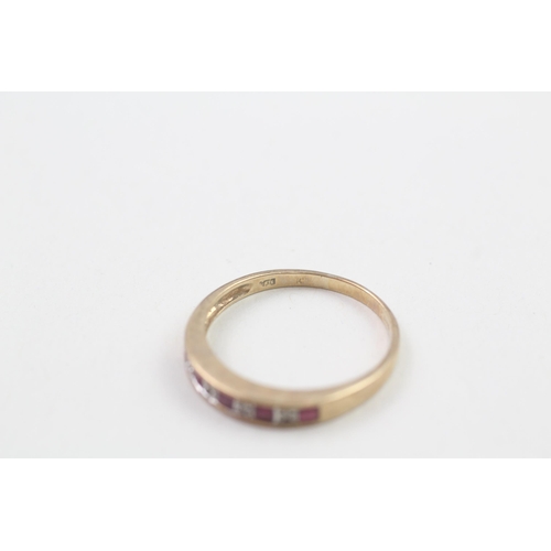 21 - 9ct gold ruby and diamond set nine stone eternity ring (1.9g) Size  Q