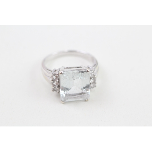 22 - 9ct white gold aquamarine and white gemstone set cocktail ring (4.5g) Size  N