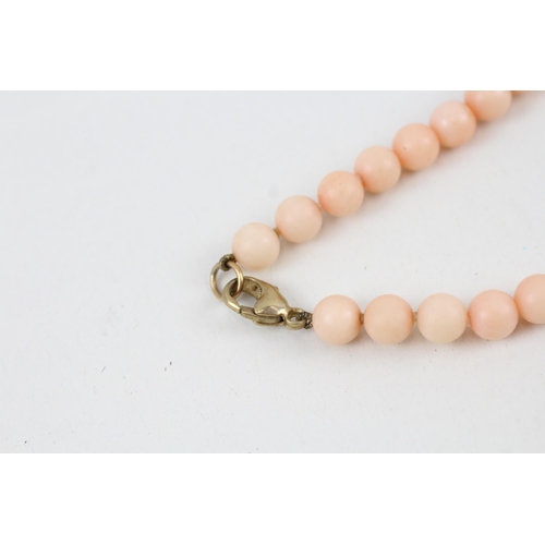 30 - 9ct gold vintage angel skin bead necklace (22.6g)