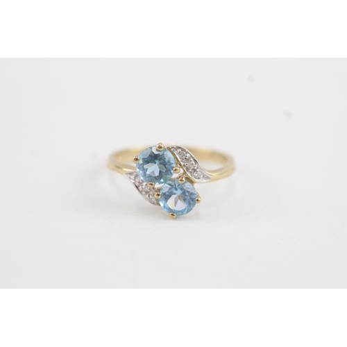 36 - 9ct gold diamond accented blue topaz bypass ring (1.7g) Size  K