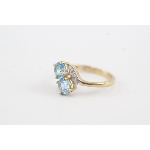 36 - 9ct gold diamond accented blue topaz bypass ring (1.7g) Size  K