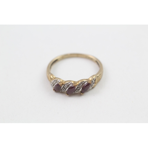 57 - 9ct gold ruby and diamond faux twist ring (2.1g) Size  P