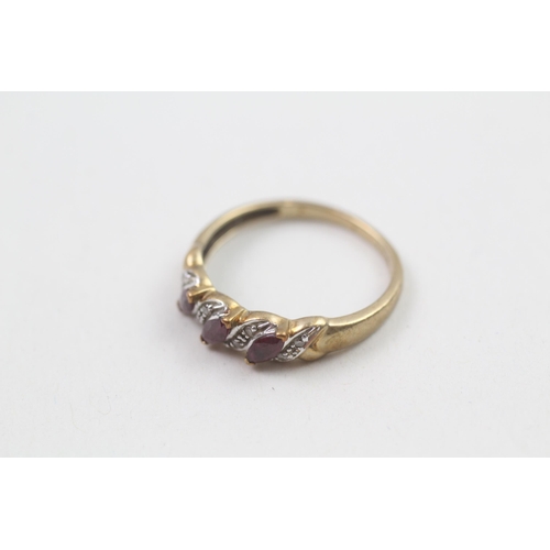 57 - 9ct gold ruby and diamond faux twist ring (2.1g) Size  P