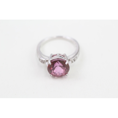 59 - 9ct white gold enhanced pink topaz and white gemstone set dress ring (3.9g) Size  N