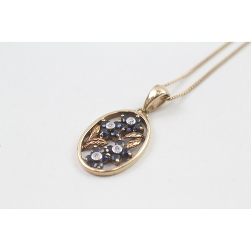 60 - 9ct gold diamond and sapphire flower framed pendant on chain (3.5g)