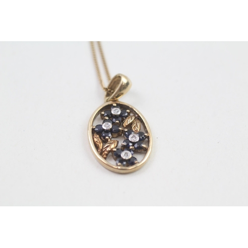 60 - 9ct gold diamond and sapphire flower framed pendant on chain (3.5g)