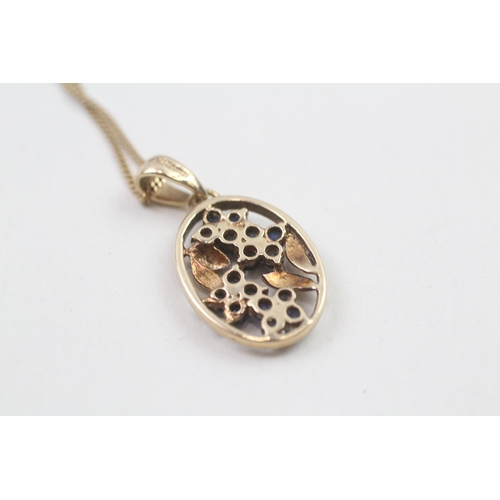 60 - 9ct gold diamond and sapphire flower framed pendant on chain (3.5g)