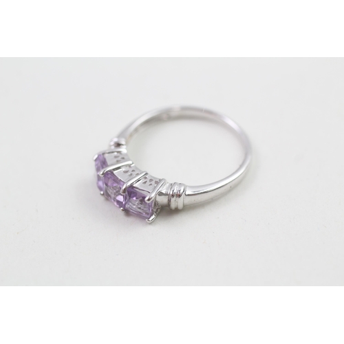 64 - 9ct white gold amethyst three stone ring (2.3g) Size  N 1/2