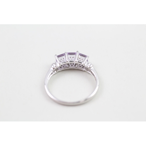 64 - 9ct white gold amethyst three stone ring (2.3g) Size  N 1/2