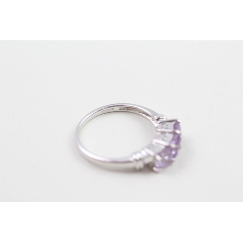 64 - 9ct white gold amethyst three stone ring (2.3g) Size  N 1/2