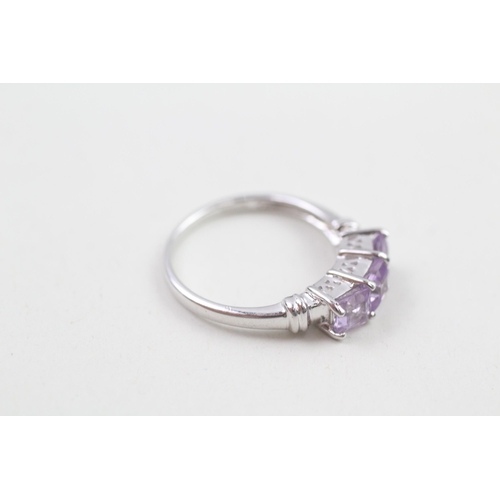 64 - 9ct white gold amethyst three stone ring (2.3g) Size  N 1/2