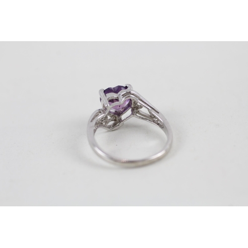 66 - 9ct white gold heart cut amethyst set dress ring (2g) Size  I