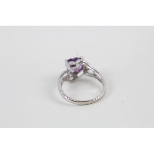 66 - 9ct white gold heart cut amethyst set dress ring (2g) Size  I