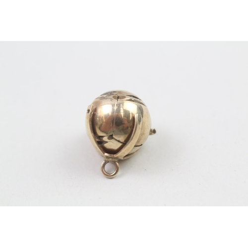 74 - 9ct gold and silver masonic ball (6g)