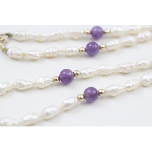 76 - 9ct gold amethyst and pearl clasped necklace with gold spacer beads (11.4g)