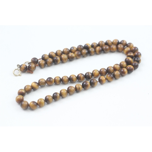 78 - 9ct gold clasp tigers eye beaded necklace (21.3g)