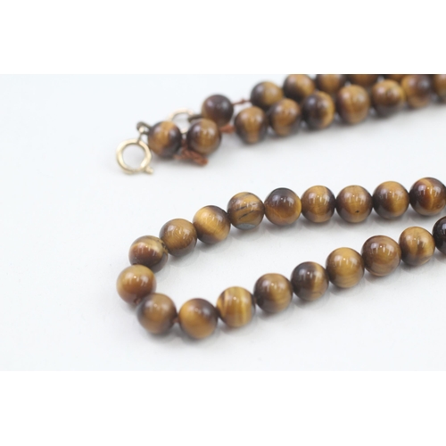 78 - 9ct gold clasp tigers eye beaded necklace (21.3g)