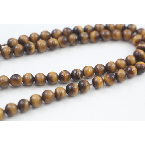 78 - 9ct gold clasp tigers eye beaded necklace (21.3g)