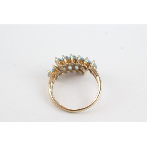 38 - 9ct gold marquise cut blue topaz set wrap ring (2.9g) Size  L