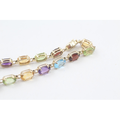 10 - 9ct gold multi-gemstone line bracelet, gemstone including amethyst, citrine, blue topaz (6.7g)