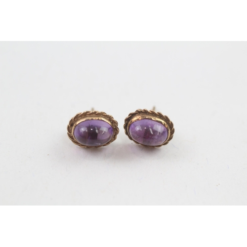 108 - 9ct gold cabochon cut stud earrings with scroll backs (1.3g)