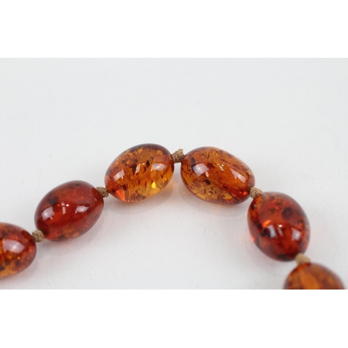 110 - 9ct gold clasped Baltic amber graduated bead necklace (44.3g)