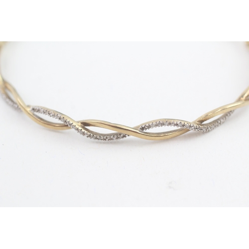 29 - 9ct gold diamond bangle, total diamond weight: 0.10ct approximately (6.1g)