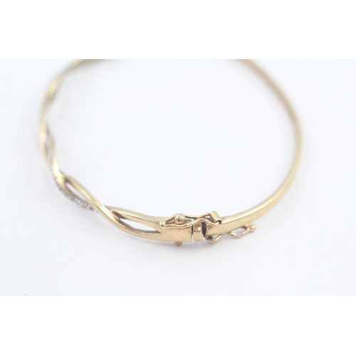 29 - 9ct gold diamond bangle, total diamond weight: 0.10ct approximately (6.1g)