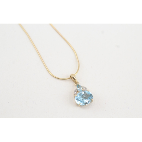 34 - 9ct gold vari-cut blue topaz & diamond pendant necklace (4.7g)