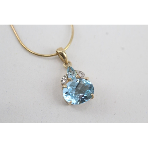 34 - 9ct gold vari-cut blue topaz & diamond pendant necklace (4.7g)