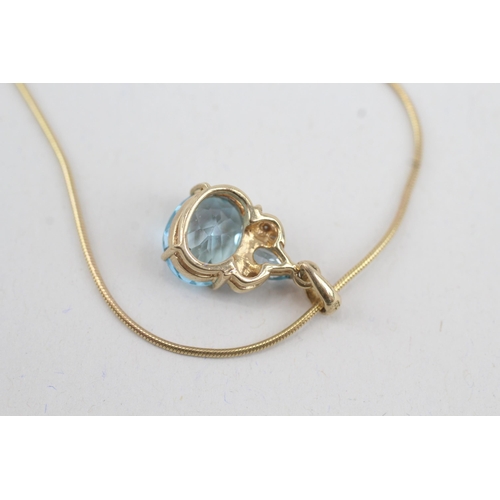 34 - 9ct gold vari-cut blue topaz & diamond pendant necklace (4.7g)