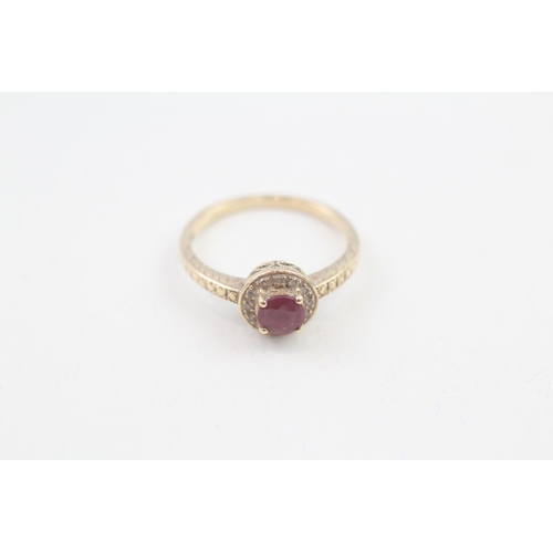 54 - 9ct gold diamond accented ruby halo ring (1.7g) Size  L