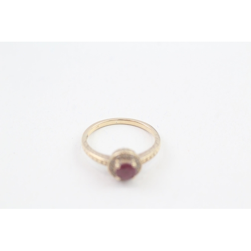 54 - 9ct gold diamond accented ruby halo ring (1.7g) Size  L