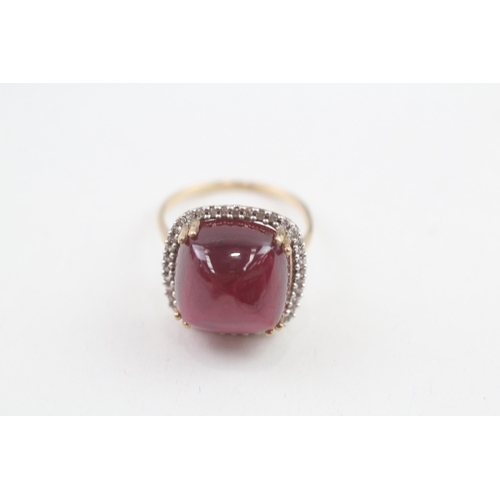 57 - 9ct gold diamond accented sugarloaf cut garnet cocktail ring (6.3g) Size  M 1/2