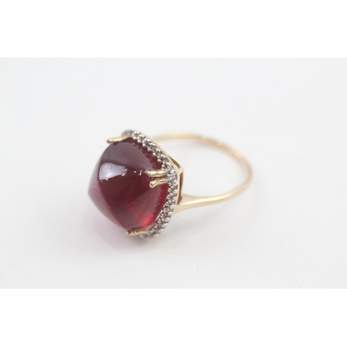 57 - 9ct gold diamond accented sugarloaf cut garnet cocktail ring (6.3g) Size  M 1/2