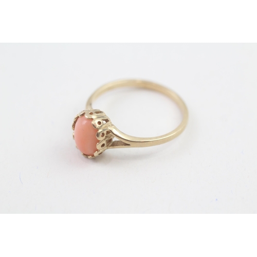 63 - 9ct gold angel skin coral cabochon set solitaire dress ring (2.1g) Size  P