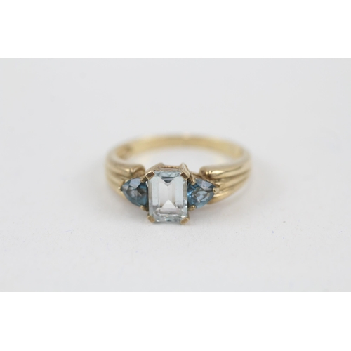 66 - 9ct gold london blue and sky blue topaz set trilogy ring (2.9g) Size  N