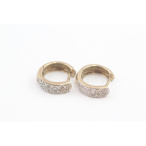 69 - 9ct gold diamond pave set huggy hoop earrings (2.1g)