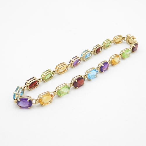 10 - 9ct gold multi-gemstone line bracelet, gemstone including amethyst, citrine, blue topaz (6.7g)