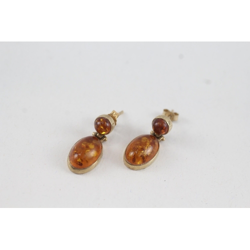 47 - 9ct gold cabochon cut amber drop earrings with scroll backs (2.6g)