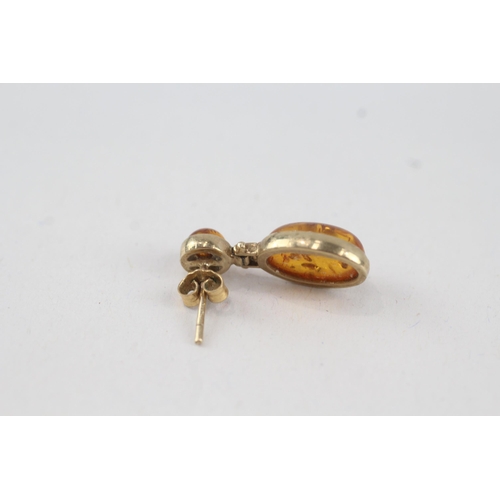 47 - 9ct gold cabochon cut amber drop earrings with scroll backs (2.6g)