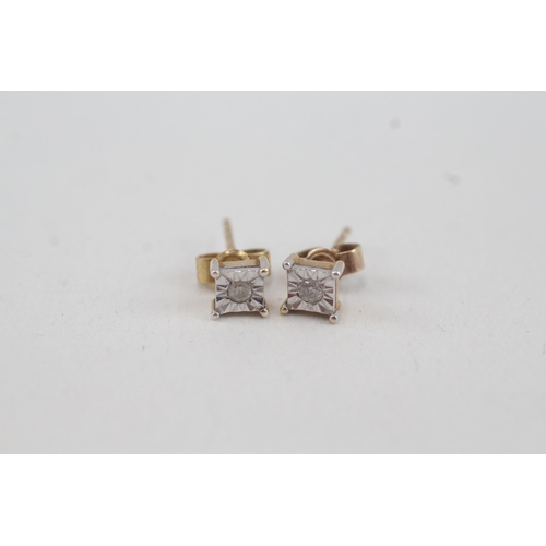 73 - 9ct gold diamond stud earrings with scroll backs (1.1g)