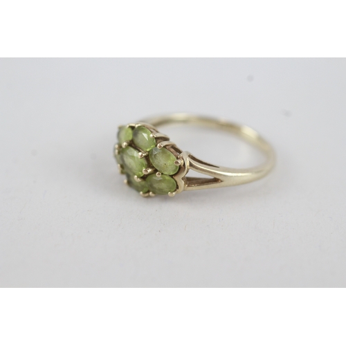 103 - 9ct gold peridot seven stone cluster ring (3.1g) Size  R