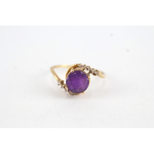 108 - 9ct gold round amethyst single stone ring with diamond surround (2.1g) Size  Q