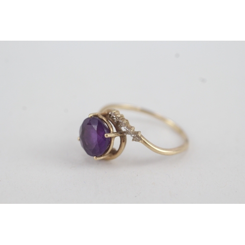 108 - 9ct gold round amethyst single stone ring with diamond surround (2.1g) Size  Q