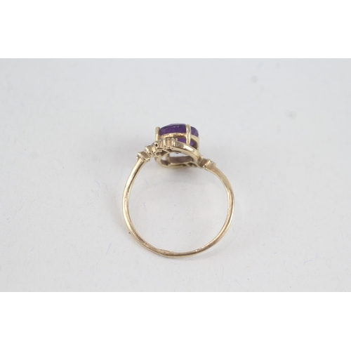 108 - 9ct gold round amethyst single stone ring with diamond surround (2.1g) Size  Q