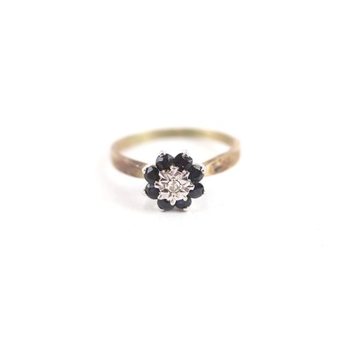 122 - 9ct gold diamond & sapphire floral cluster ring (2.1g) Size  O