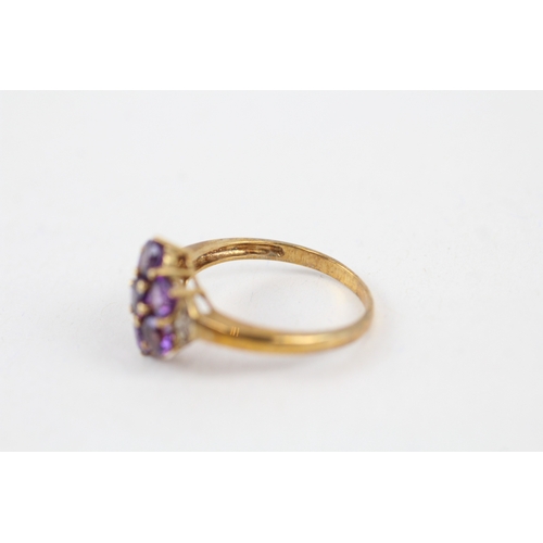 42 - 9ct gold amethyst seven stone floral cluster ring with diamond sides (2.7g) Size  Q 1/2